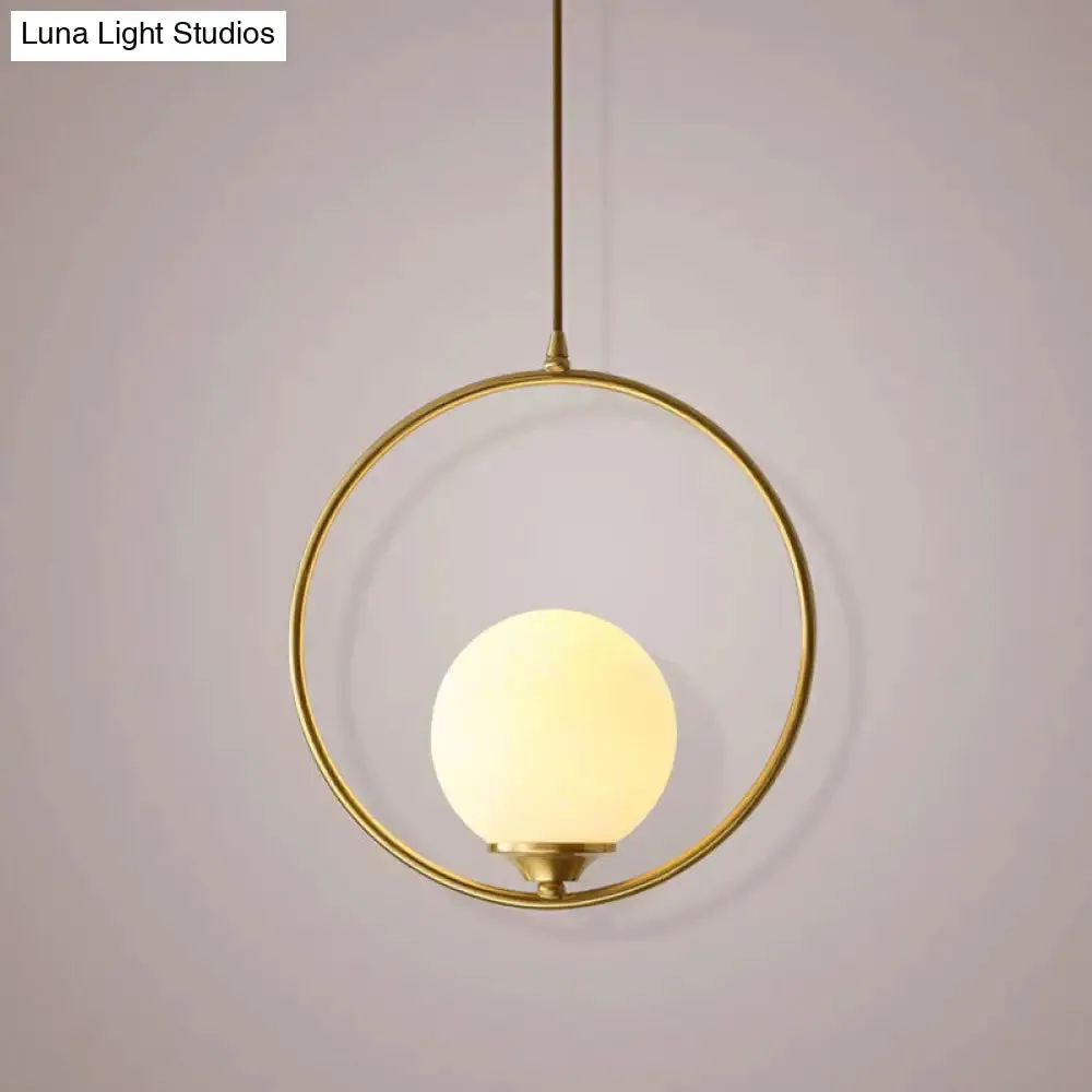 Minimalist Antique Gold Ball Ceiling Lamp with Cream Glass Shade and Ring Decoration