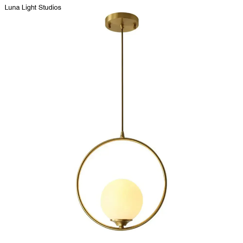 Minimalist Antique Gold Ball Ceiling Lamp with Cream Glass Shade and Ring Decoration